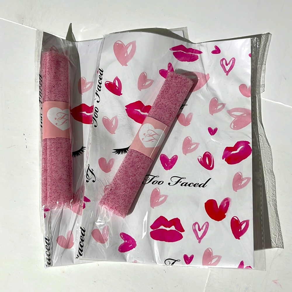 Set of two Too Faced wrapping paper and ribbon set Valentine's Day pink lips